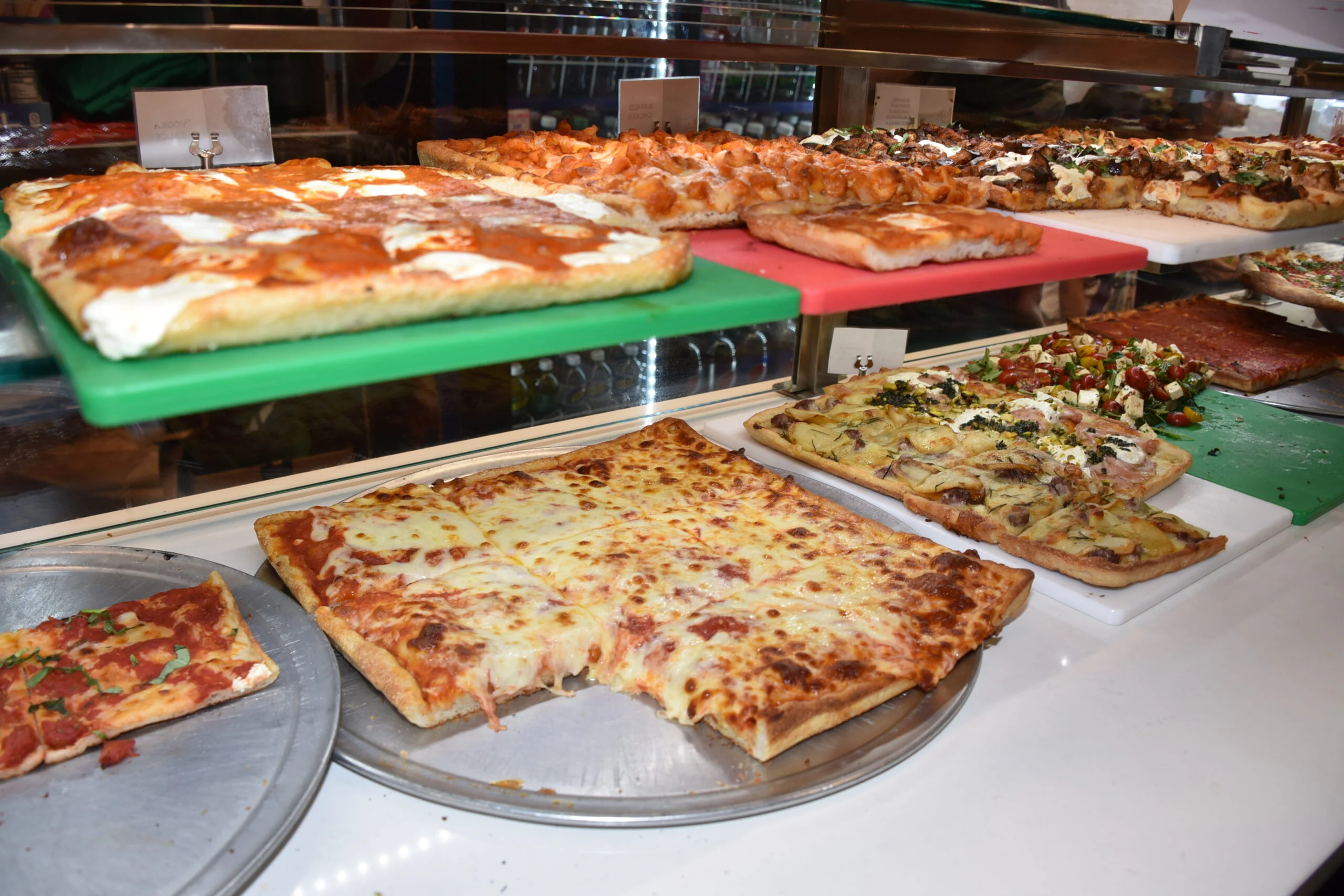 Pizza counter with fresh slices